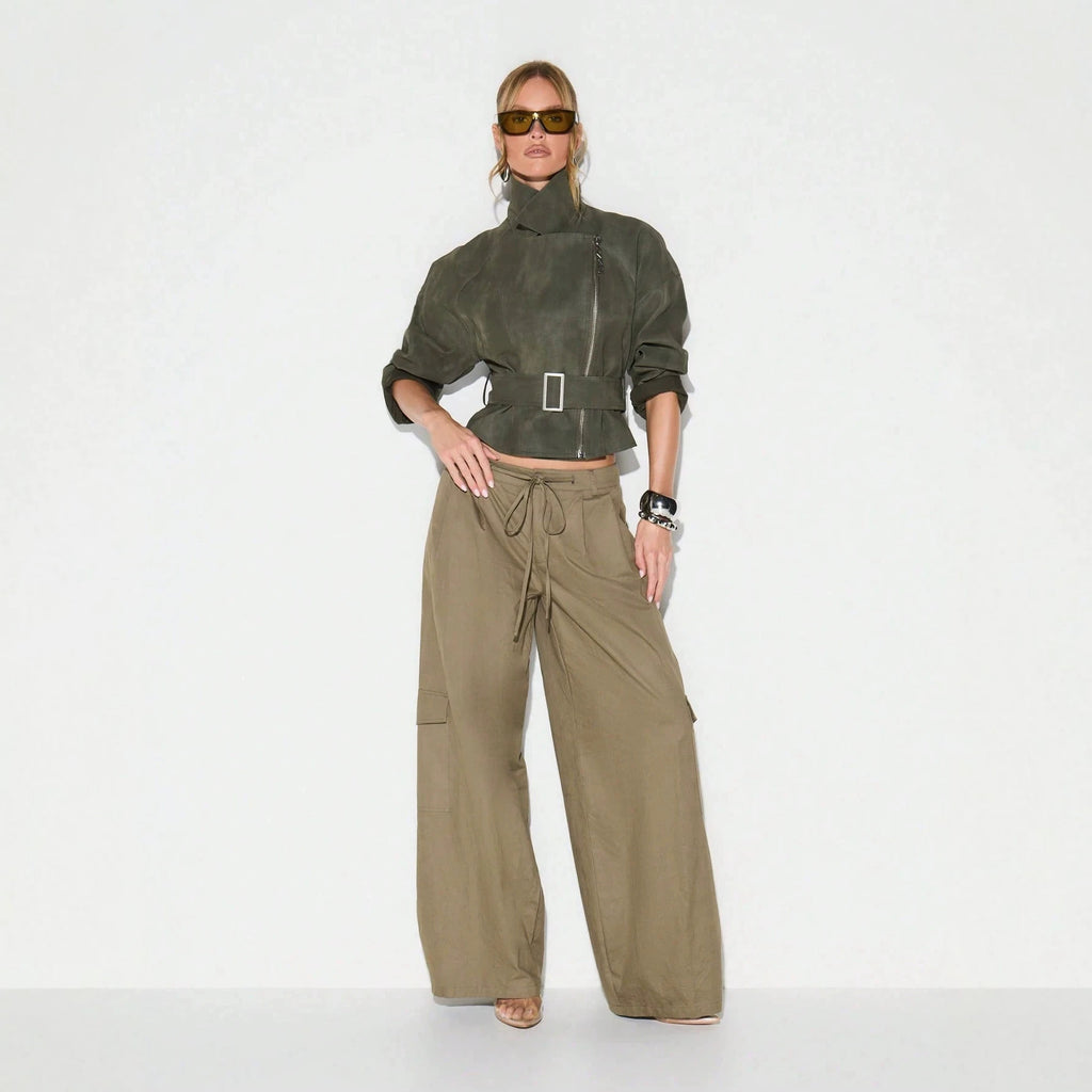 Belted Faux Suede Moto Jacket with Asymmetric Zip in Olive — full-length view on model with wide-leg trousers