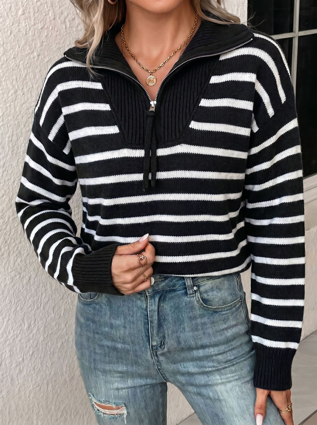 Striped Half-Zip Collared Sweater in Black & White — front view on model with jeans