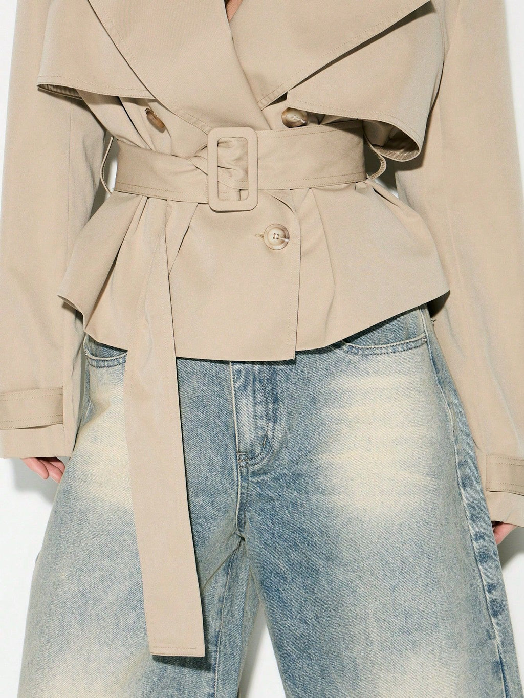 Cropped Double-Breasted Trench Jacket with Belt and Epaulettes in Khaki — close-up of the belt and buttons