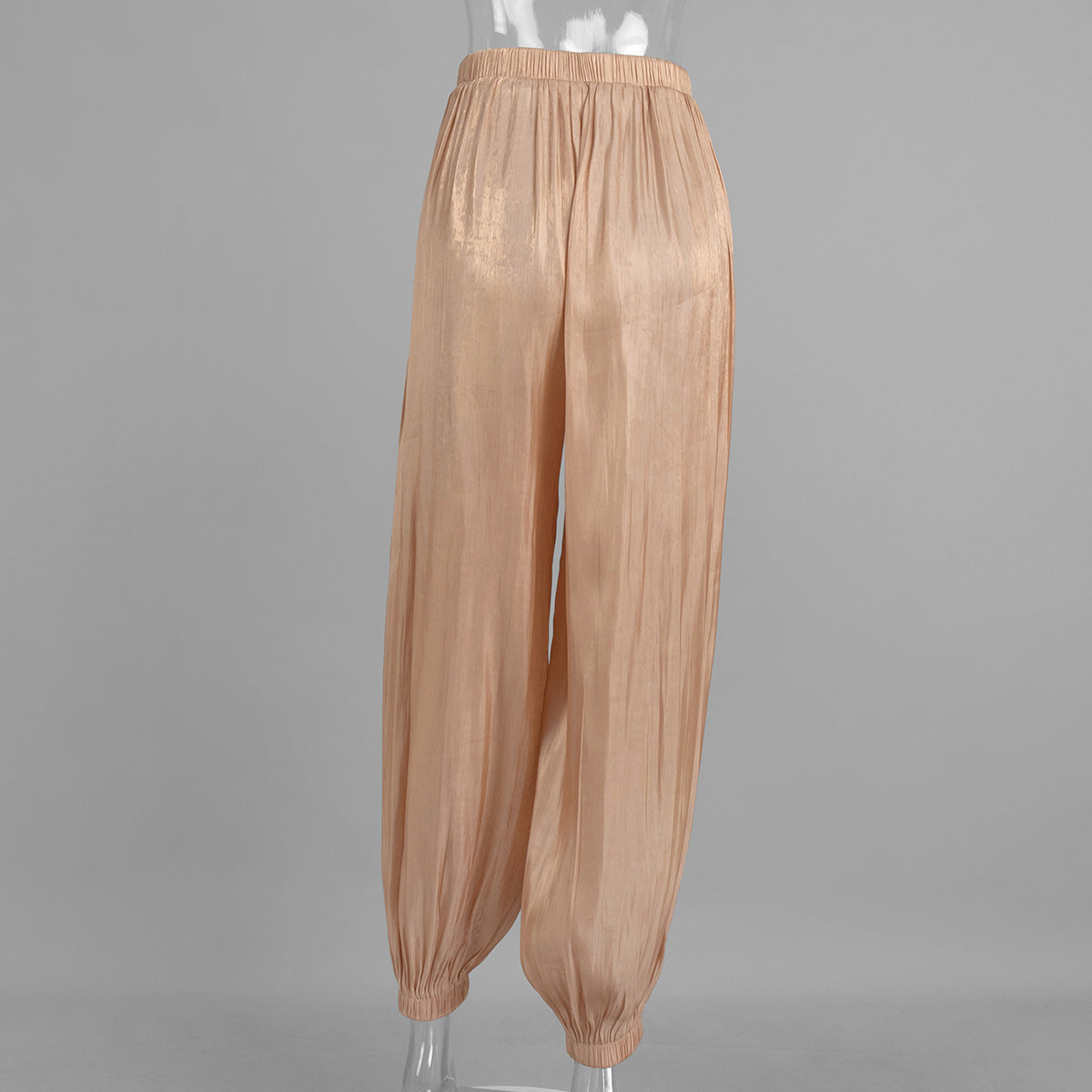 Shiny Pleated Harem Pants with Elastic Cuffs in Champagne — back view on mannequin
