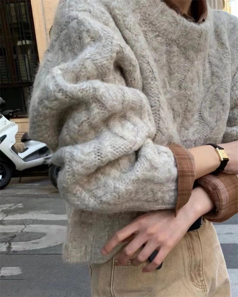 Chunky Cable-Knit Crew-Neck Sweater in Ivory — close view on model