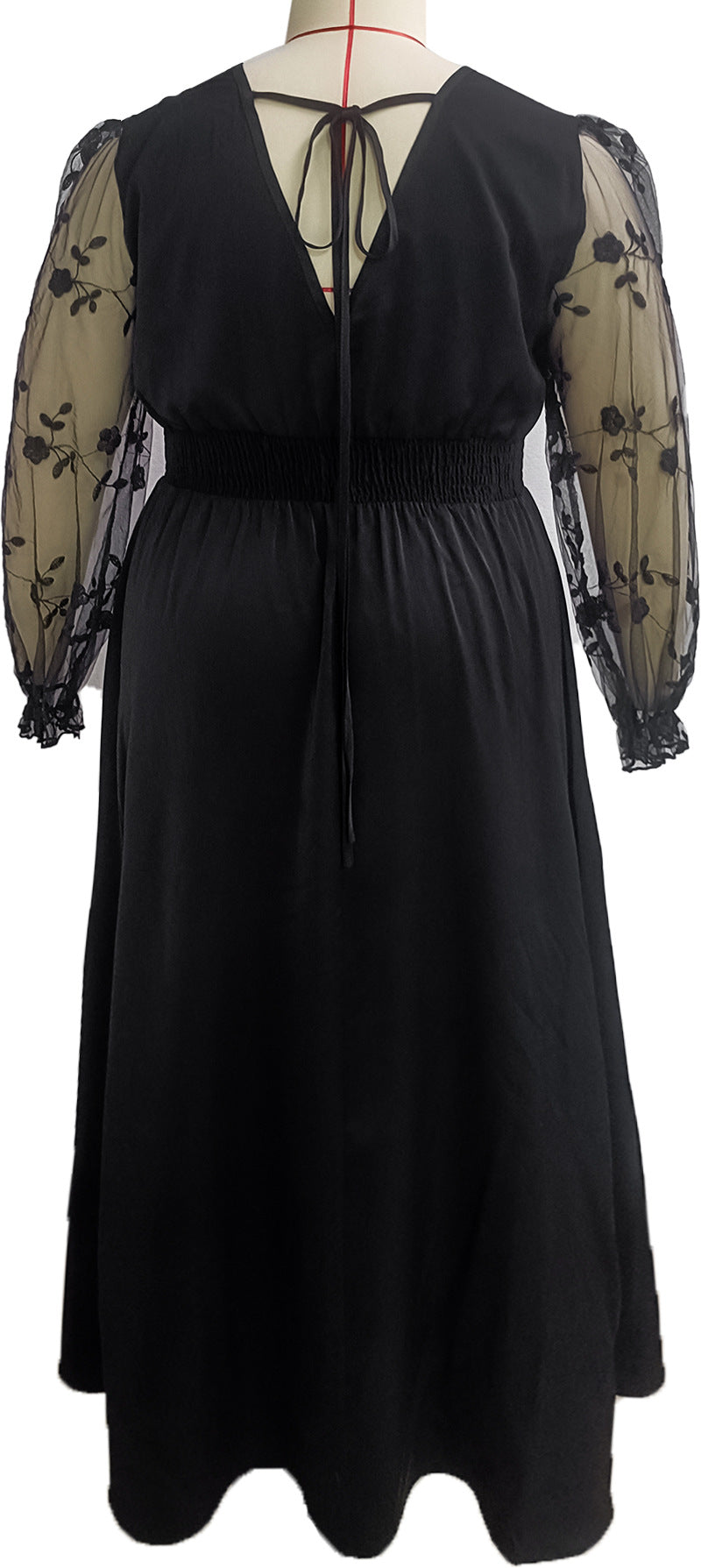 Plus-Size Lace-Sleeve V-Neck Maxi Gown with Slit in Black — back view on mannequin showing the neck tie