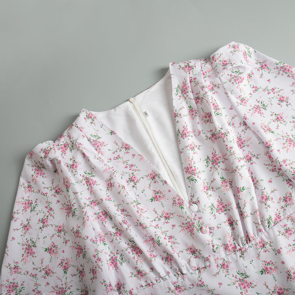 Floral Puff-Sleeve V-Neck Maxi Dress in White Floral — close-up of V-neck, buttons, and puff shoulders