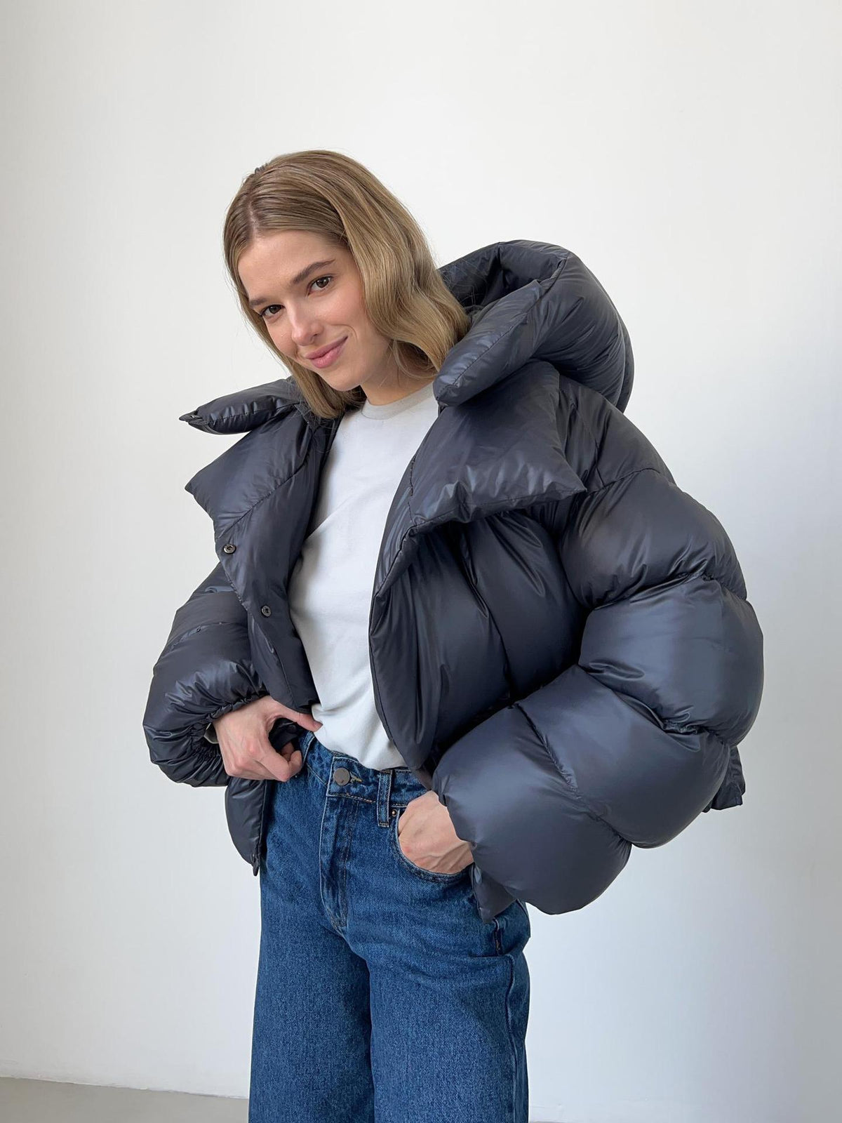 Cropped Hooded Puffer Jacket with Drawstring Hem in Slate Gray — worn open over a white tee