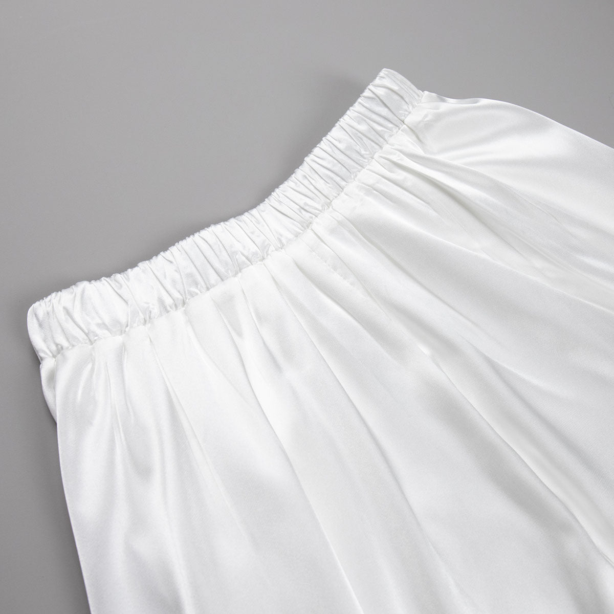 Satin A-Line Midi Skirt with Elastic Waist in Ivory White — close-up of elastic waistband