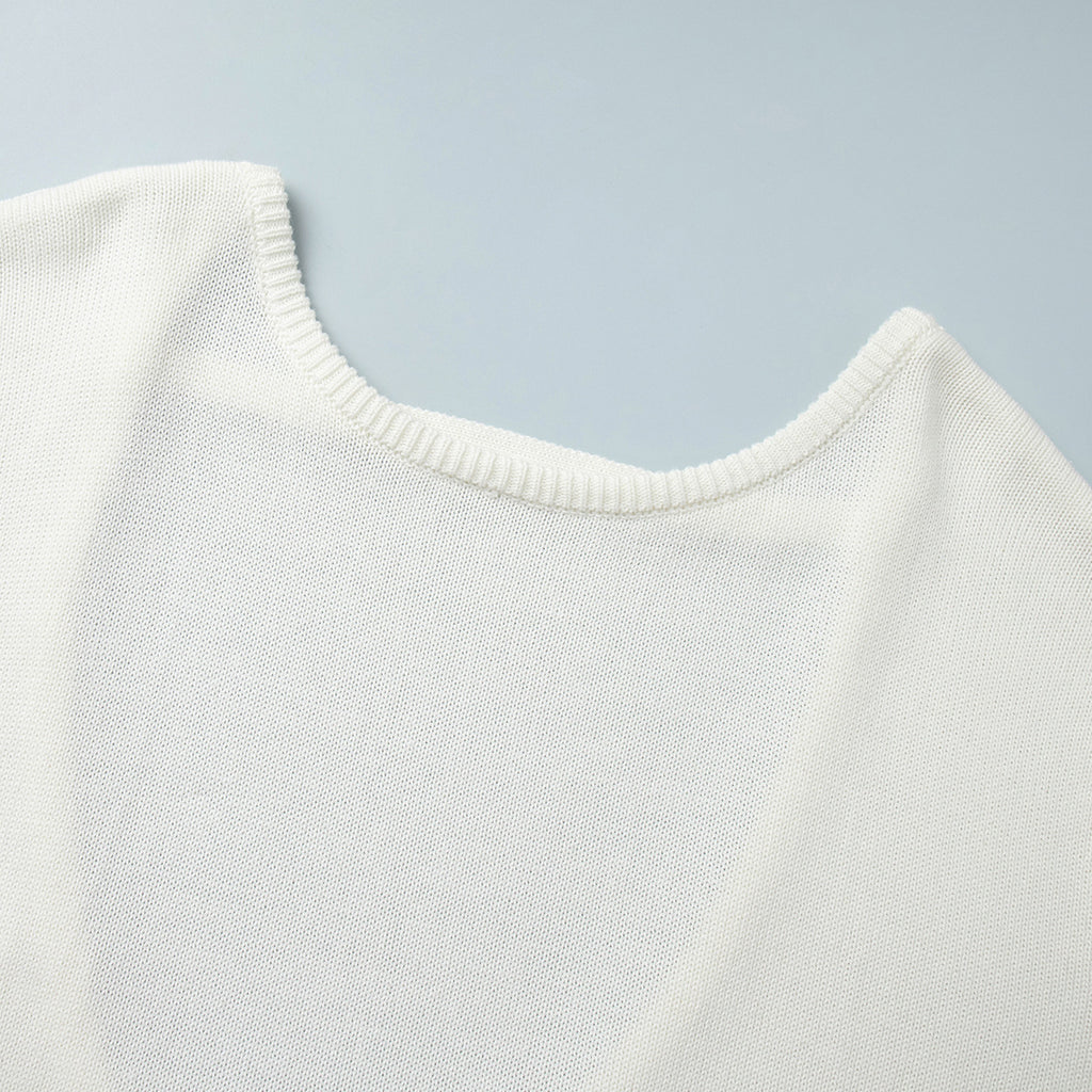 Oversized Open-Back Cotton Knit Sweater in Cream — close-up of the front neckline