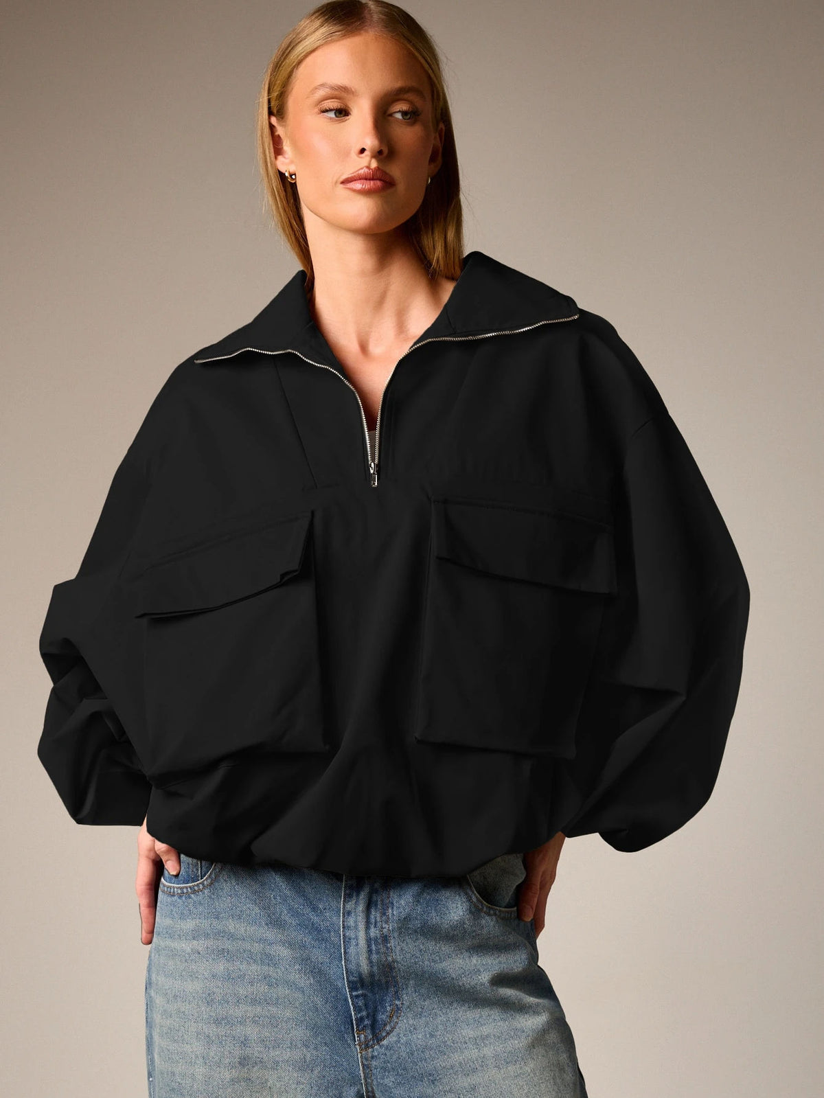 Oversized Half-Zip Funnel-Neck Windbreaker Jacket in Black — front view on model