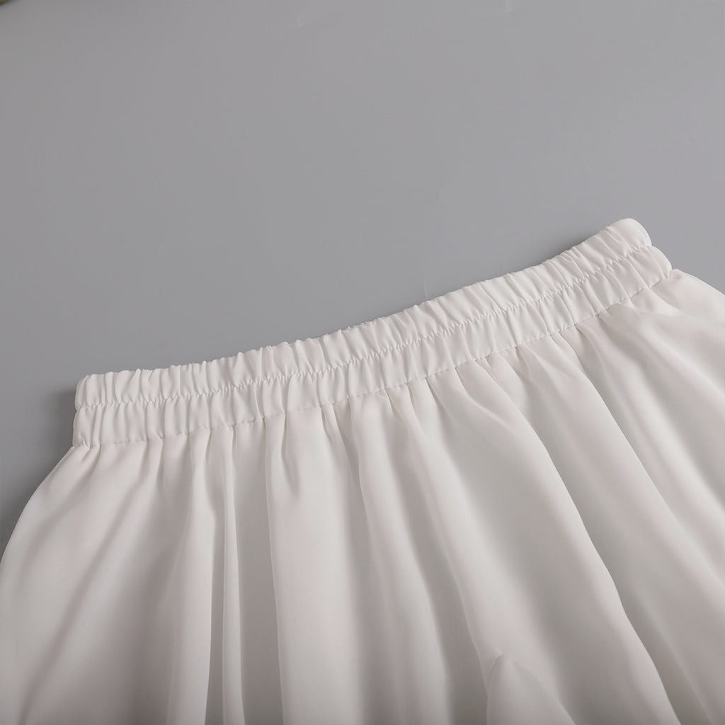 Pleated Bubble Mini Skirt in White — close-up of pleats