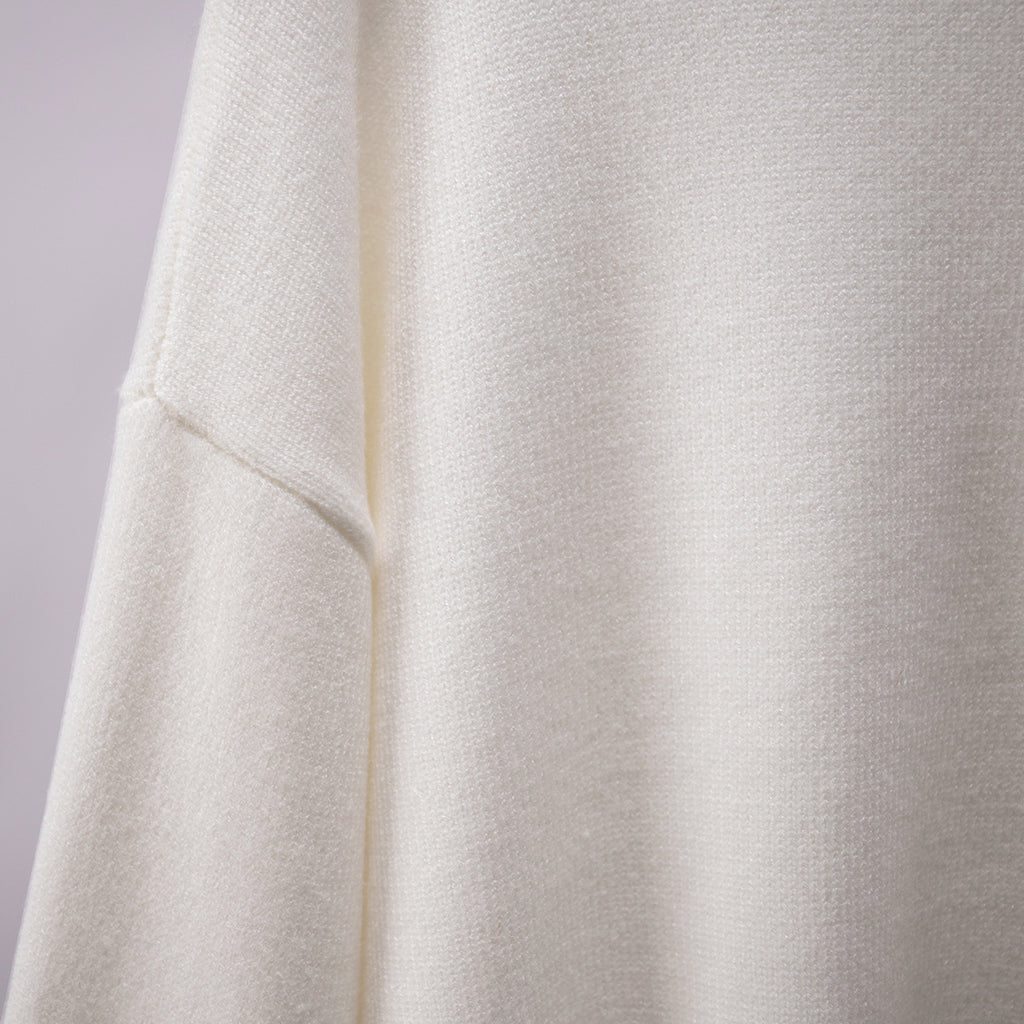 Oversized Knit Turtleneck Sweater in Ivory — knit texture close-up