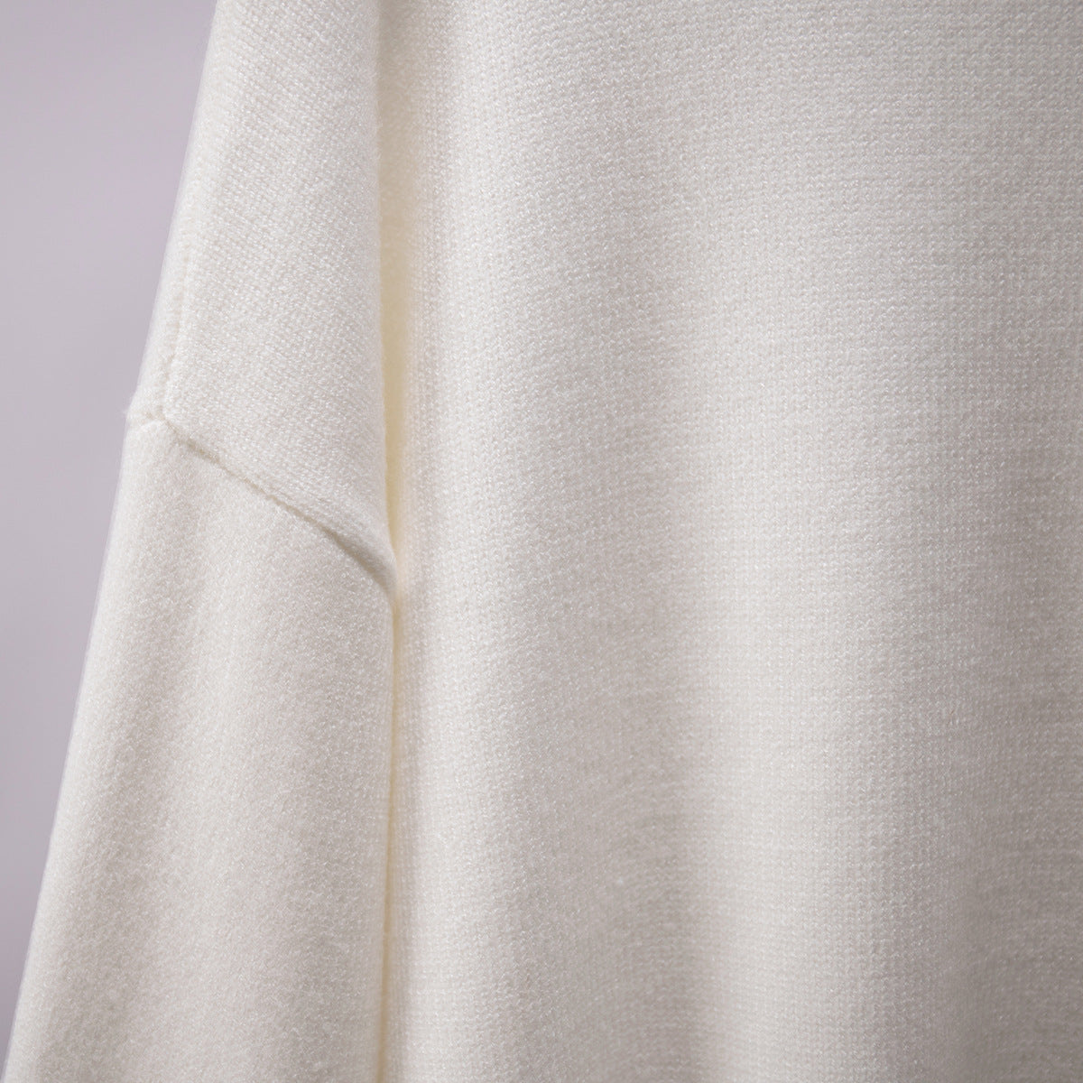 Oversized Knit Turtleneck Sweater in Ivory — knit texture close-up