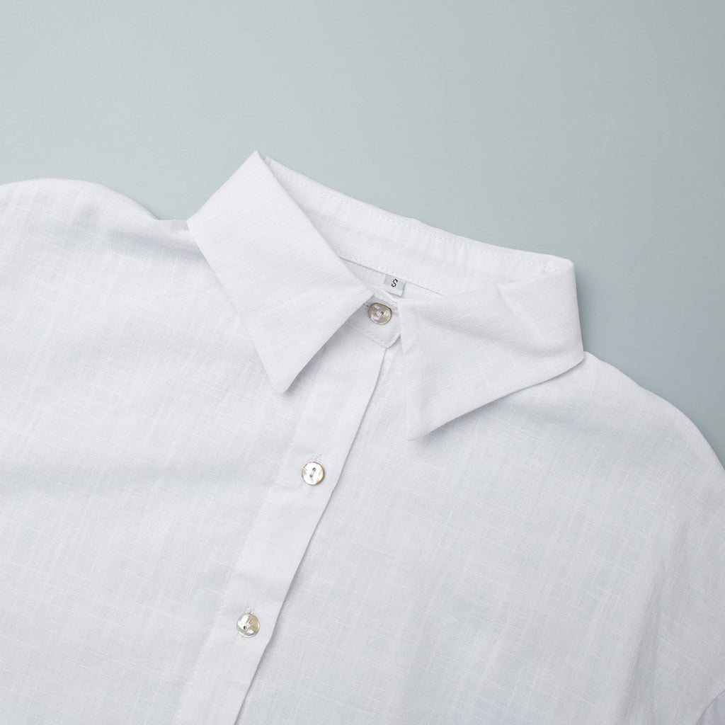 Relaxed Cotton Button-Down Shirt in White — close-up of the pointed collar