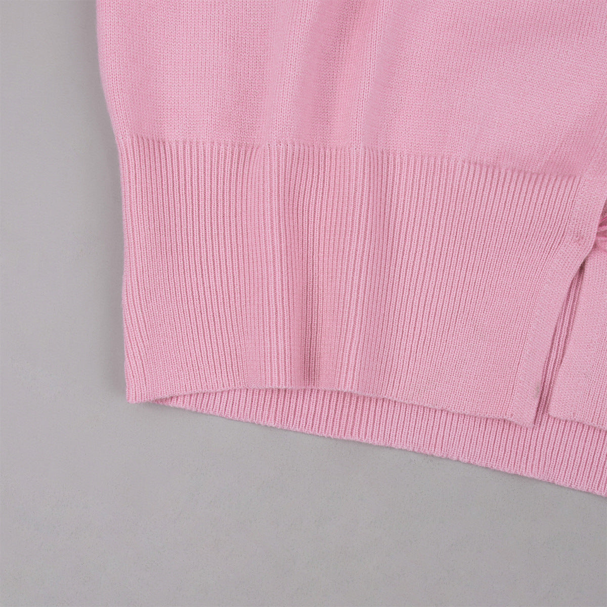 Cropped Button Cardigan & Fold-Over Waist Wide-Leg Knit Pants Set in Blush Pink — close-up of the ribbed hem