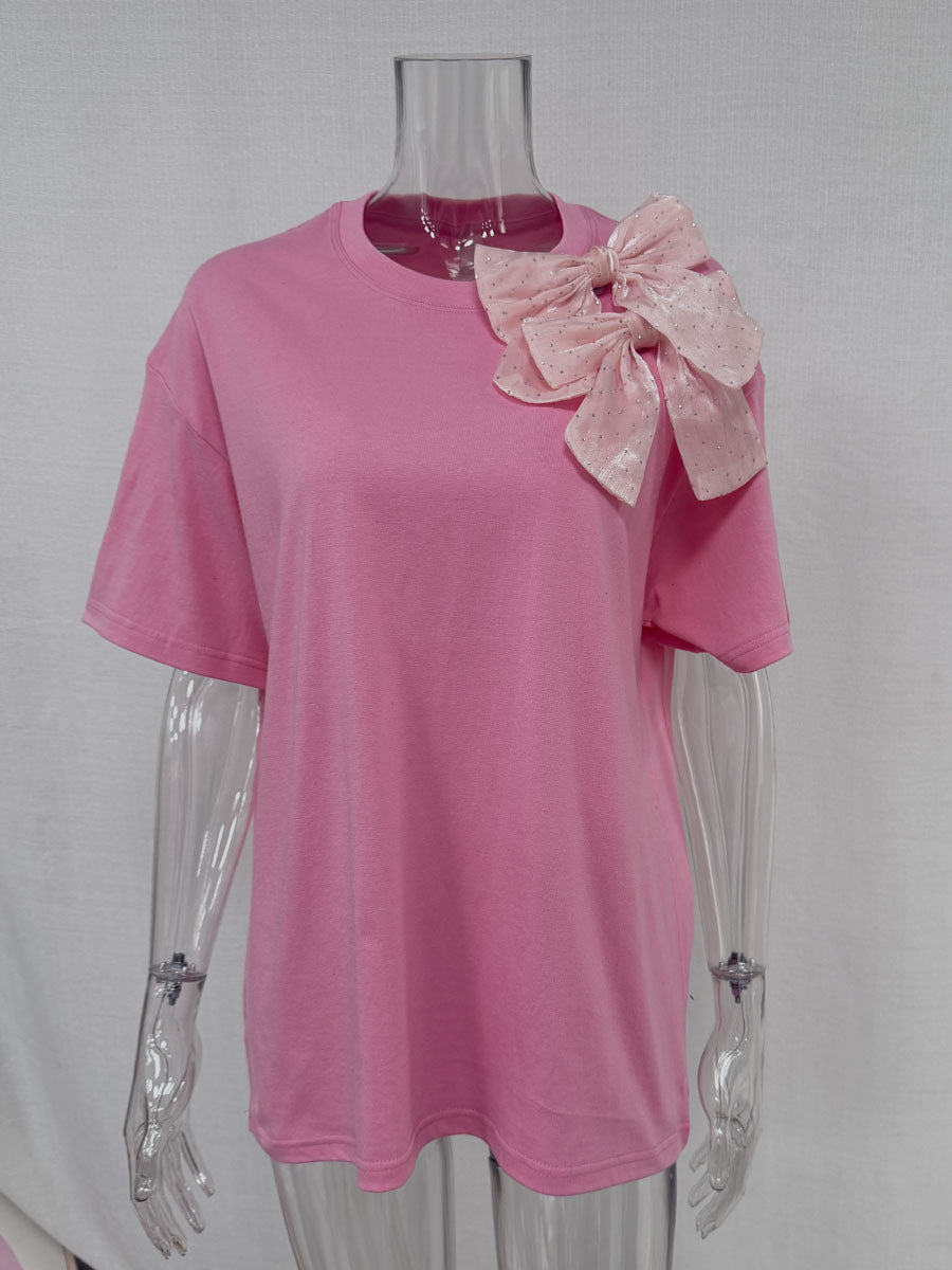 Oversized Cotton Tee with a Rhinestone Bow in Pink — front view on mannequin