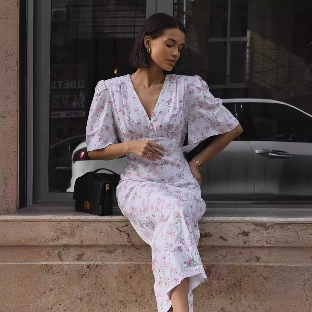 Floral Puff-Sleeve V-Neck Maxi Dress in White Floral — seated on model