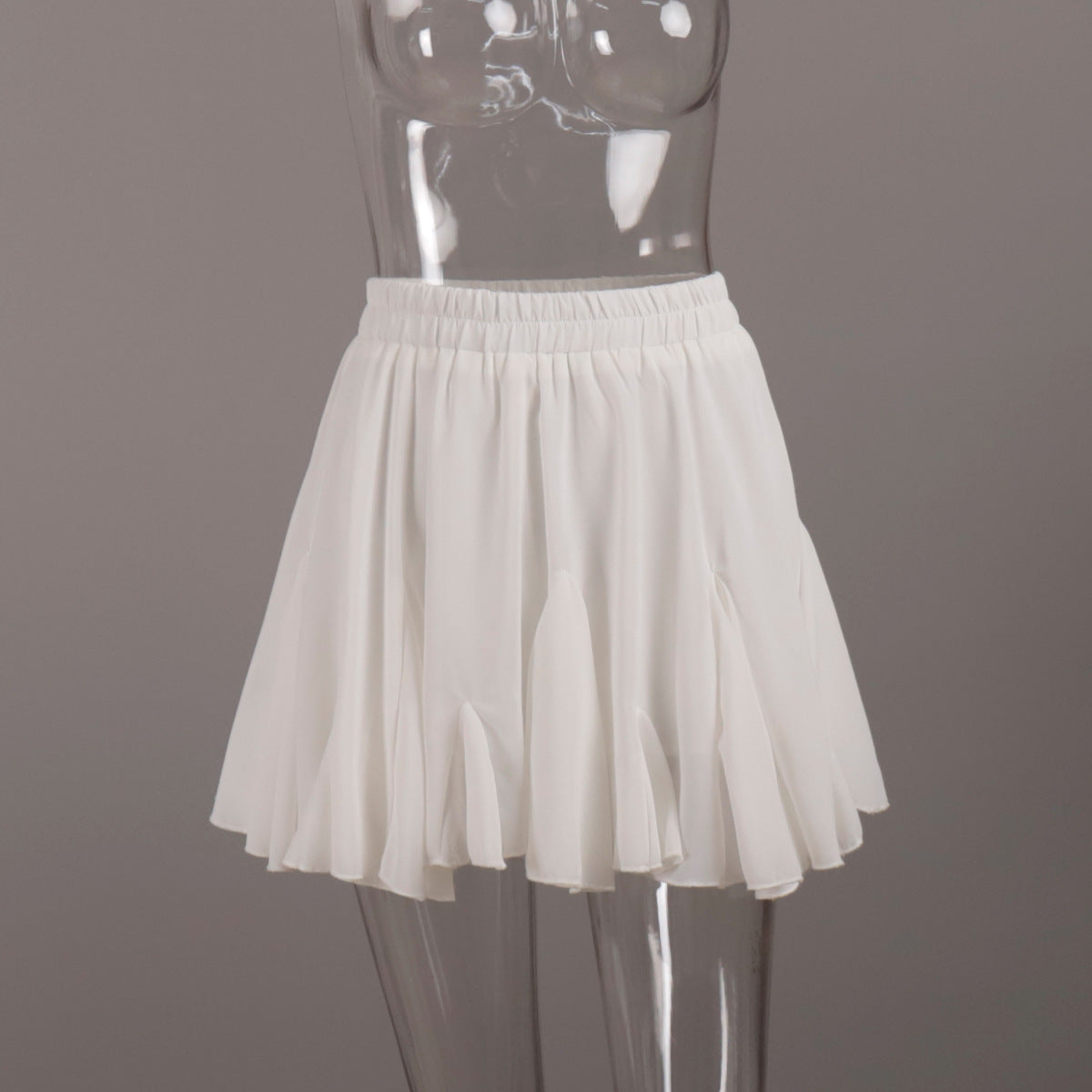 Pleated Bubble Mini Skirt in White — front view on mannequin