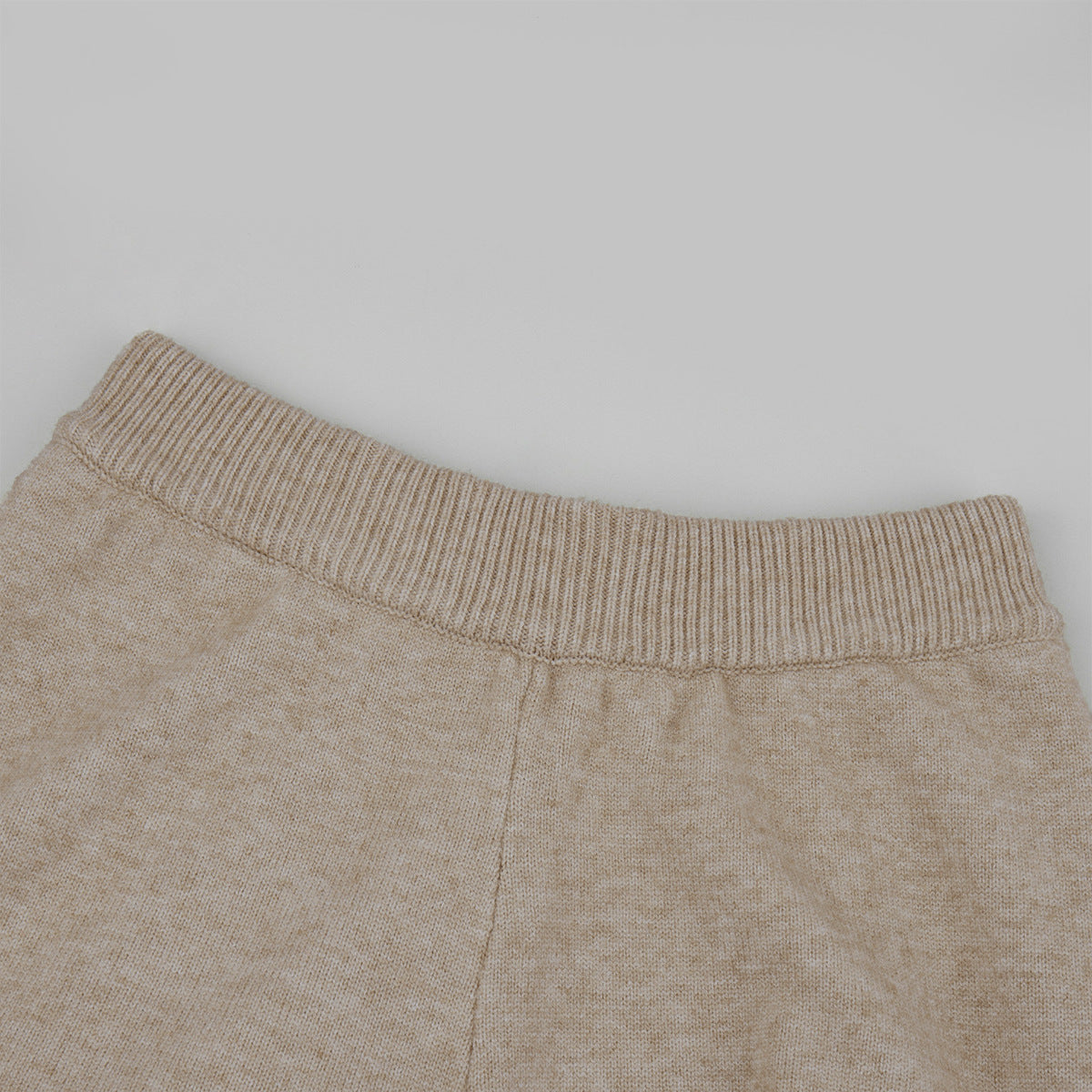Three-Piece Knit Set: Zip-Up Cardigan, Sleeveless Top & Wide-Leg Pants in Oat — close-up of the pants waistband