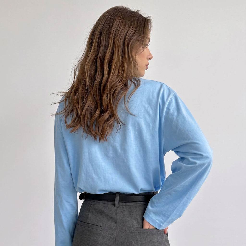 Relaxed Cotton Long-Sleeve Pocket Tee in Sky Blue — back view on model