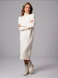 Relaxed Turtleneck Sweater Dress in Ivory — front view on model