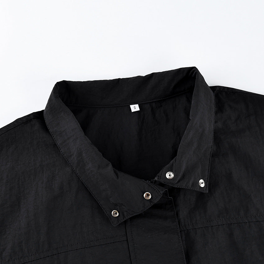 Oversized Stand-Collar Nylon Jacket with Drawcord Hem in Black — close-up of the stand collar