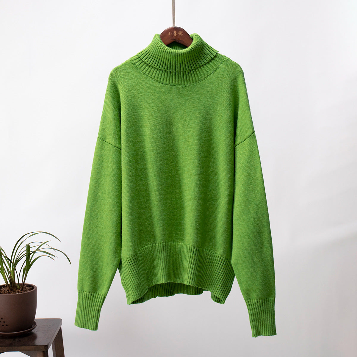 Oversized Knit Turtleneck Sweater in Apple Green — front view