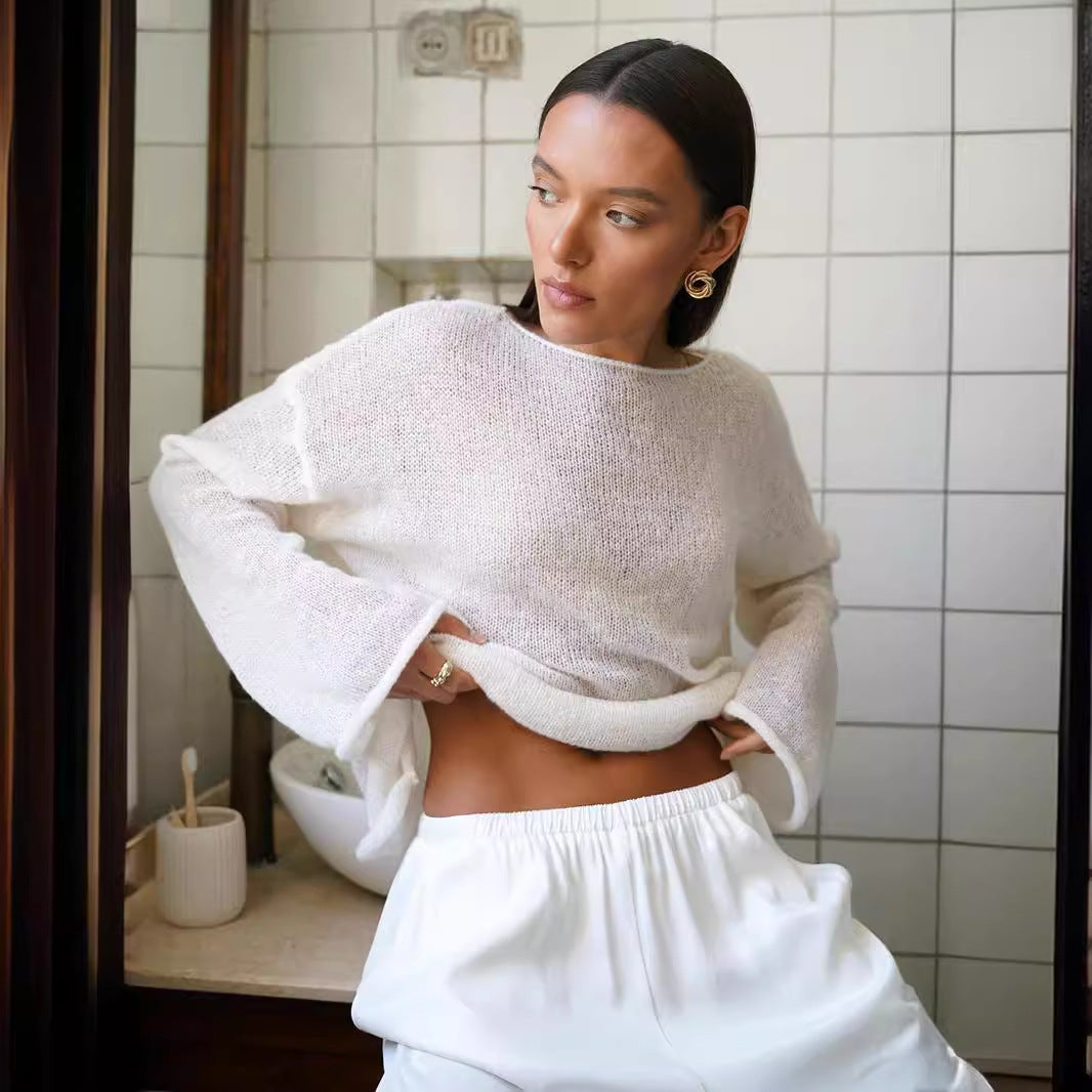 Sheer Open-Knit Bell Sleeve Sweater in White — front view on model, bathroom