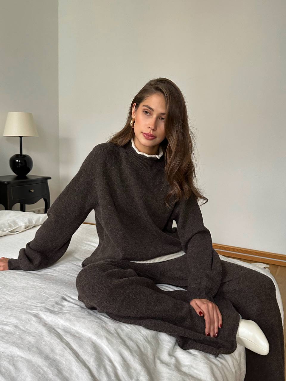 Oversized Wool-Blend Sweater & Wide-Leg Knit Pants Set with Contrast Trim in Espresso — seated view on model