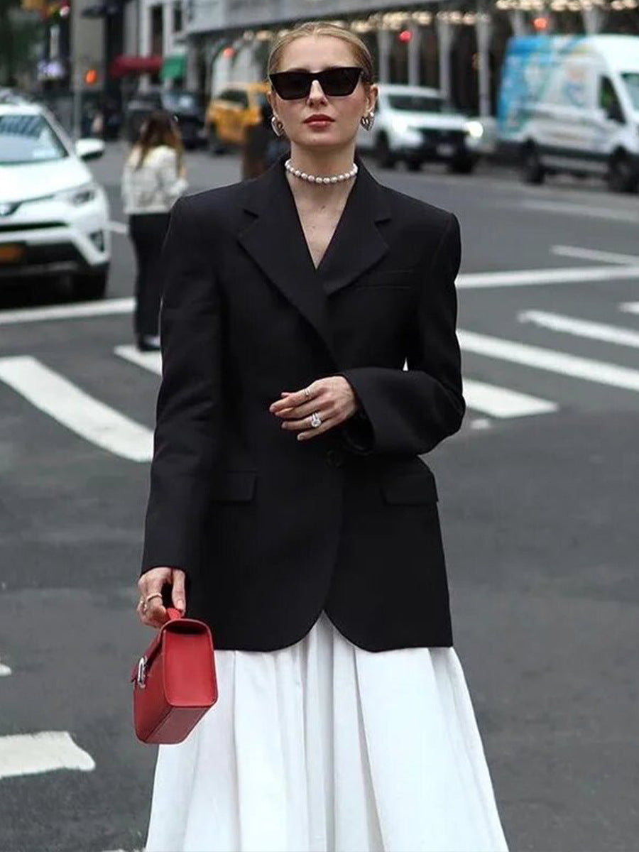 Tailored Two-Button Blazer with Cinched Waist in Black — worn with a long white skirt