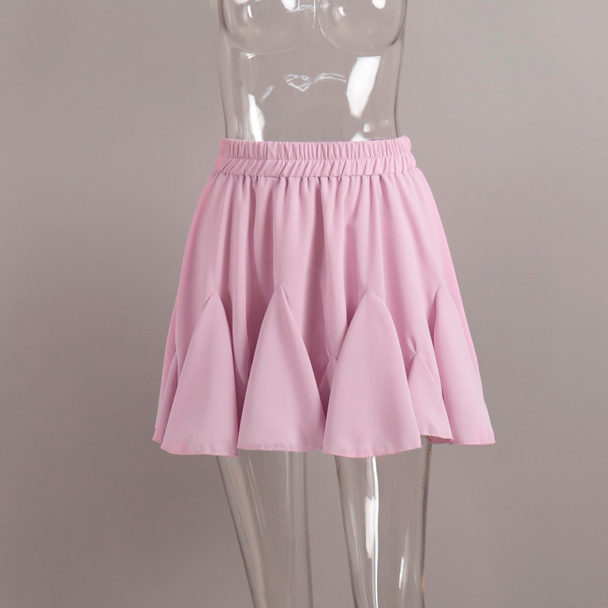 Pleated Bubble Mini Skirt in Soft Pink — front view on mannequin