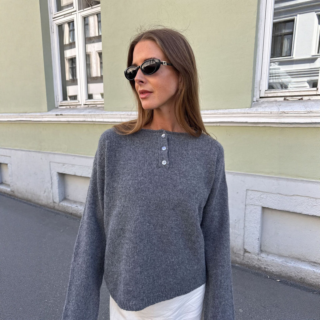 Relaxed Henley Sweater with Button Placket in Charcoal Gray — front view on model