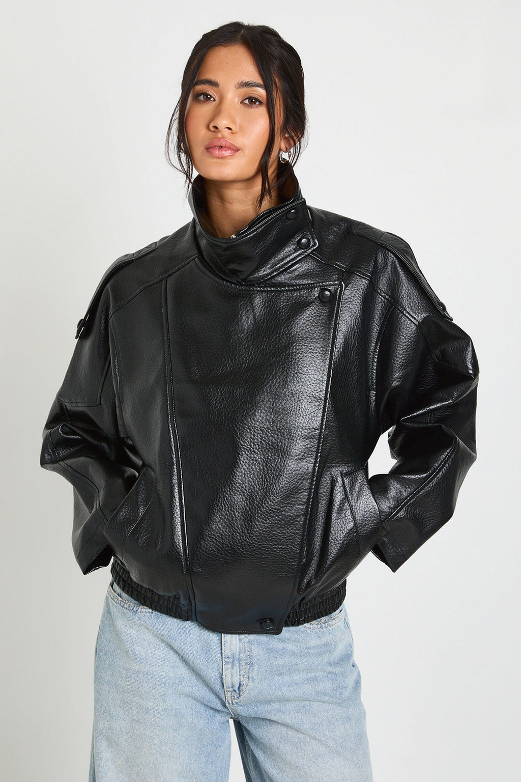 Oversized Stand-Collar Faux Leather Jacket in Black — close view on model