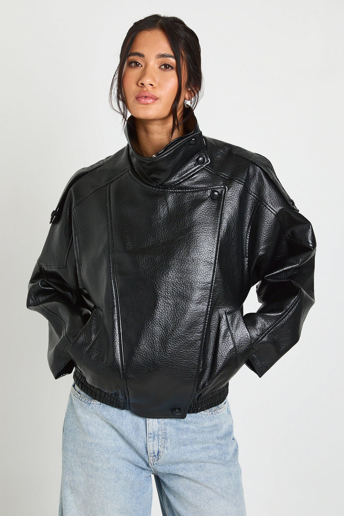 Oversized Stand-Collar Faux Leather Jacket in Black — close view on model