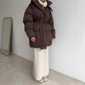 Belted Hooded Puffer Jacket with Zip Front in Espresso Brown — front view on model