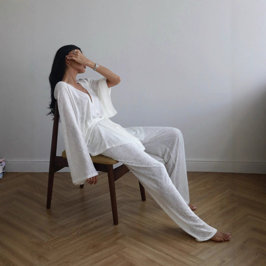 Wrap Tie Top & Wide-Leg Lounge Pants Set in White — side view on model, seated