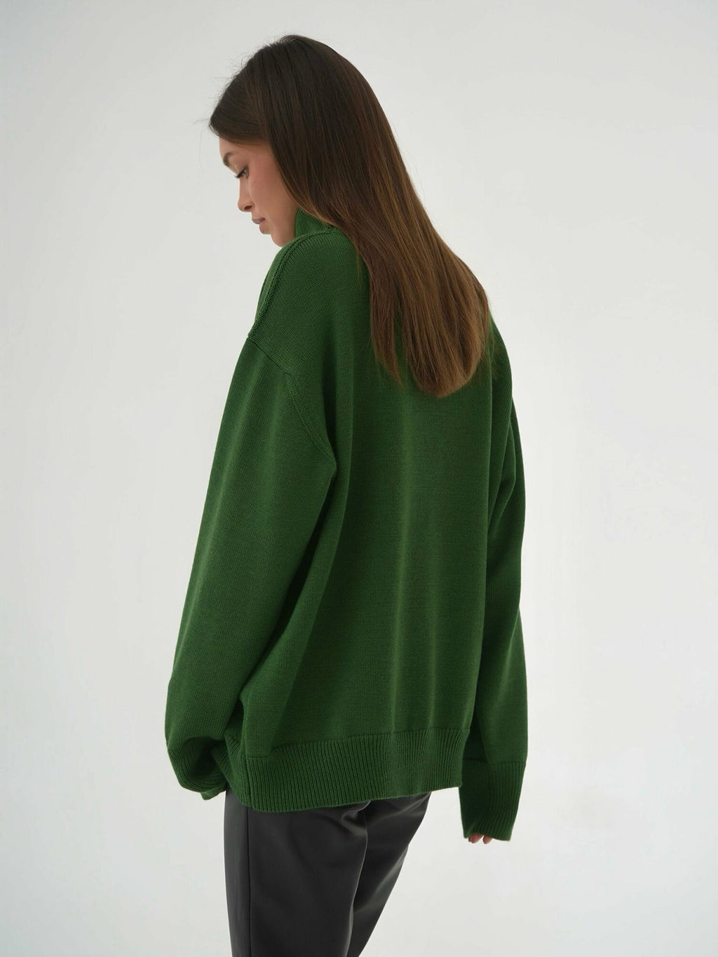 Oversized Knit Turtleneck Sweater in Forest Green — back view on model