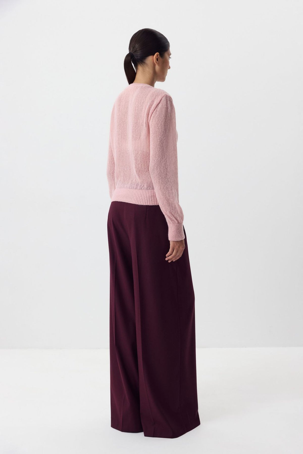 Airy Button-Front Knit Cardigan in Blush Pink — back view on model