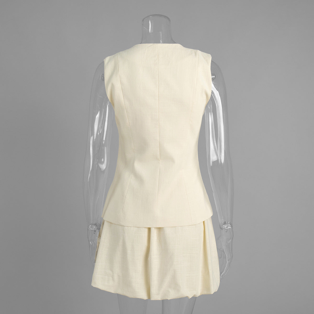 Cotton Peplum Vest & Bubble Mini Skirt Set in Apricot — set on mannequin