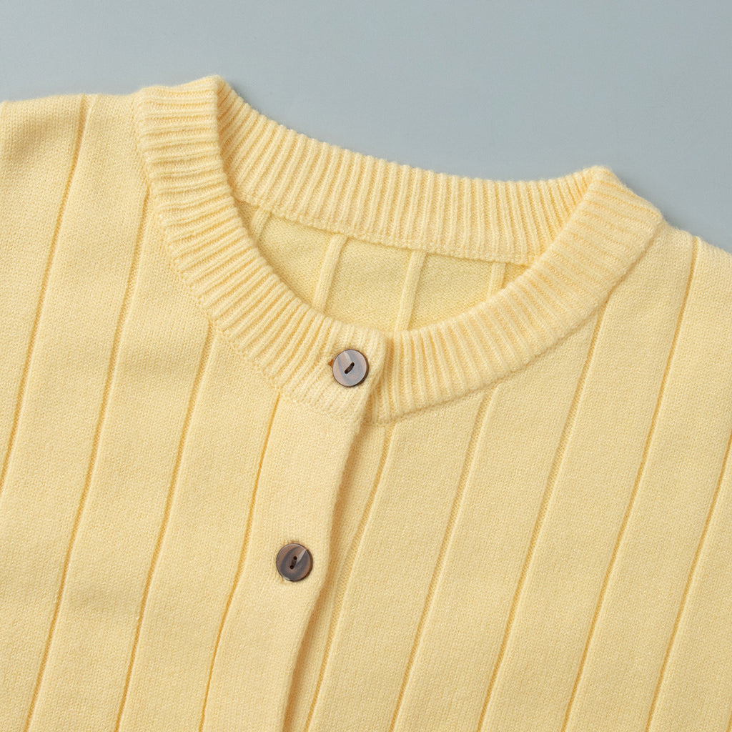 Oversized Wide-Rib Crew Neck Button Cardigan in Butter Yellow — close-up of the crew neck and button