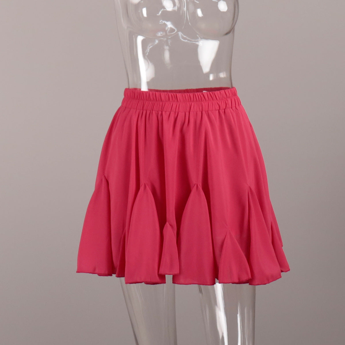 Pleated Bubble Mini Skirt in Hot Pink — front view on mannequin