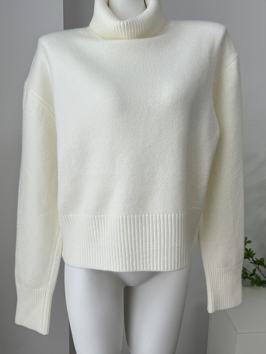 Relaxed High Neck Sweater with Ribbed Cuffs in Ivory — front view on mannequin