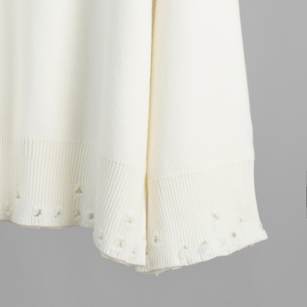 Distressed-Hem Oversized Knit Sweater & Jogger Set in Cream — close-up of the distressed hem