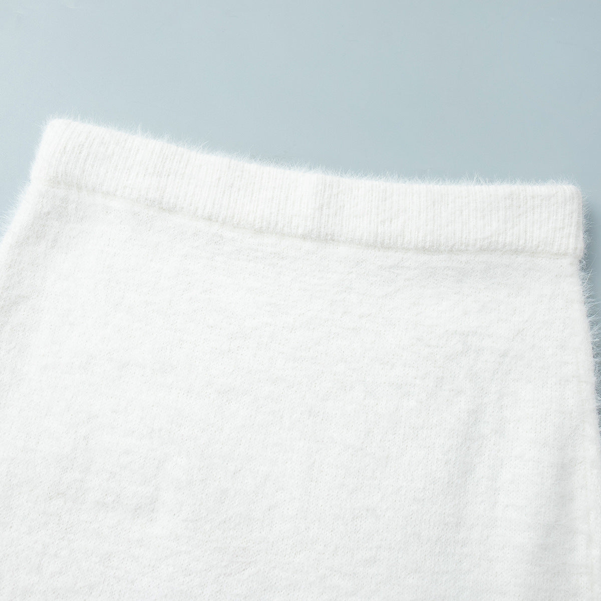 Fuzzy Knit Button Cardigan & Maxi Skirt Set in Winter White — close-up of the skirt waistband