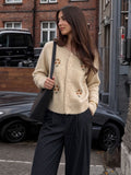 Floral Embroidered Button Cardigan in Oatmeal — front view on model