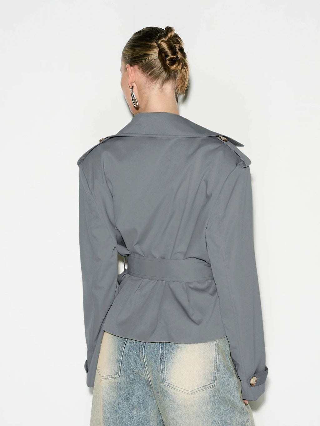 Cropped Double-Breasted Trench Jacket with Belt and Epaulettes in Gray — back view on model