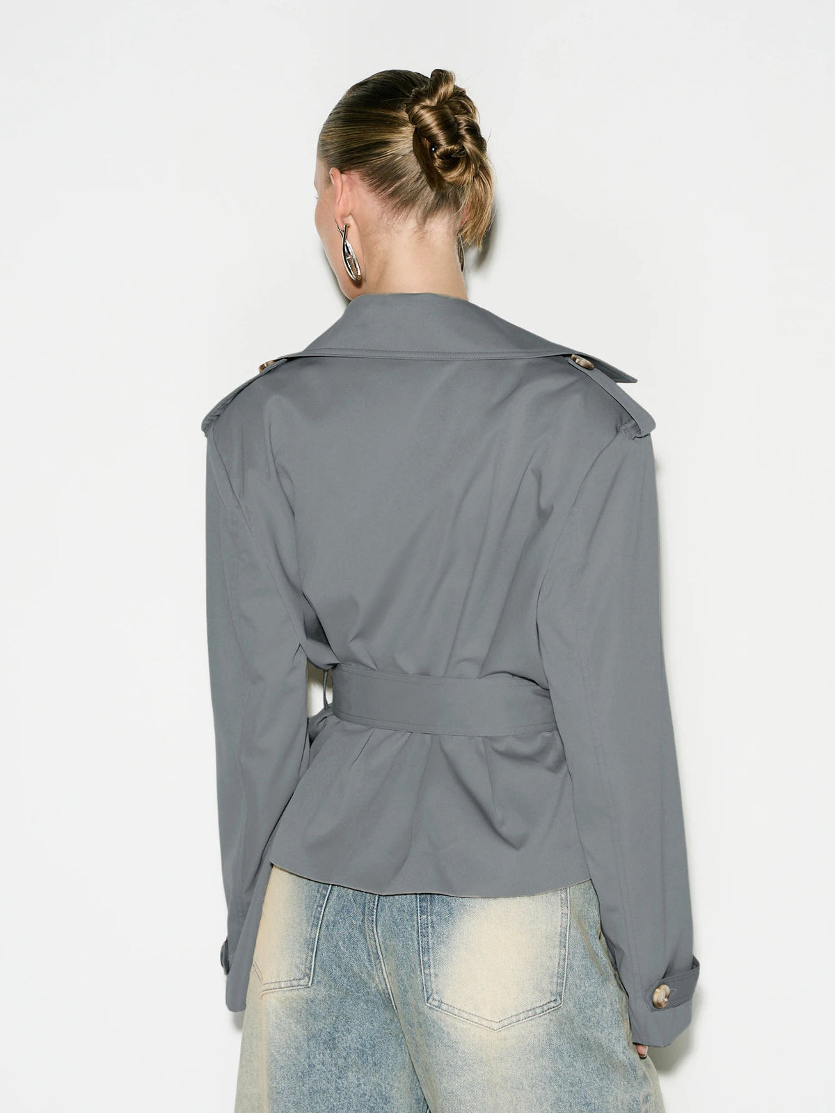 Cropped Double-Breasted Trench Jacket with Belt and Epaulettes in Gray — back view on model