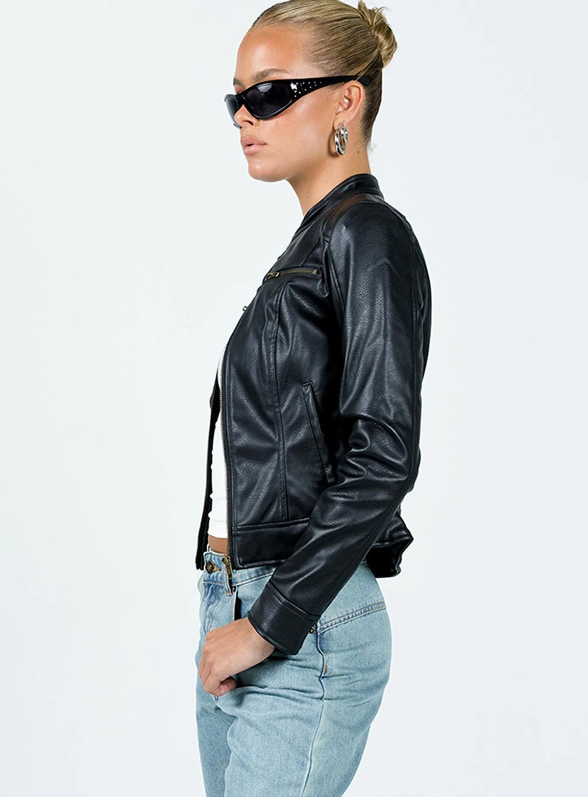 Fitted Faux Leather Moto Jacket with Stand Collar in Black — side view on model