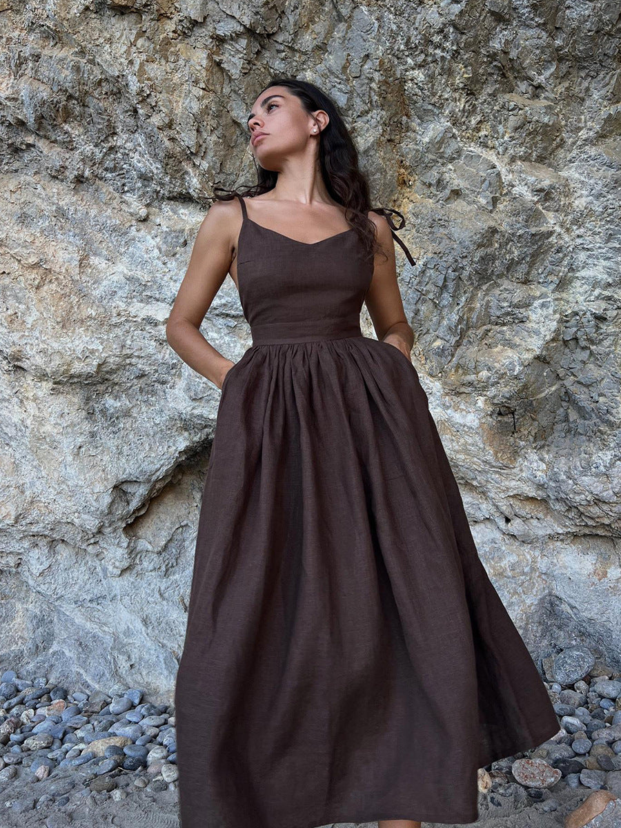 Tie-Shoulder Open-Back Cotton Maxi Dress in Chocolate — on model, hands in pockets