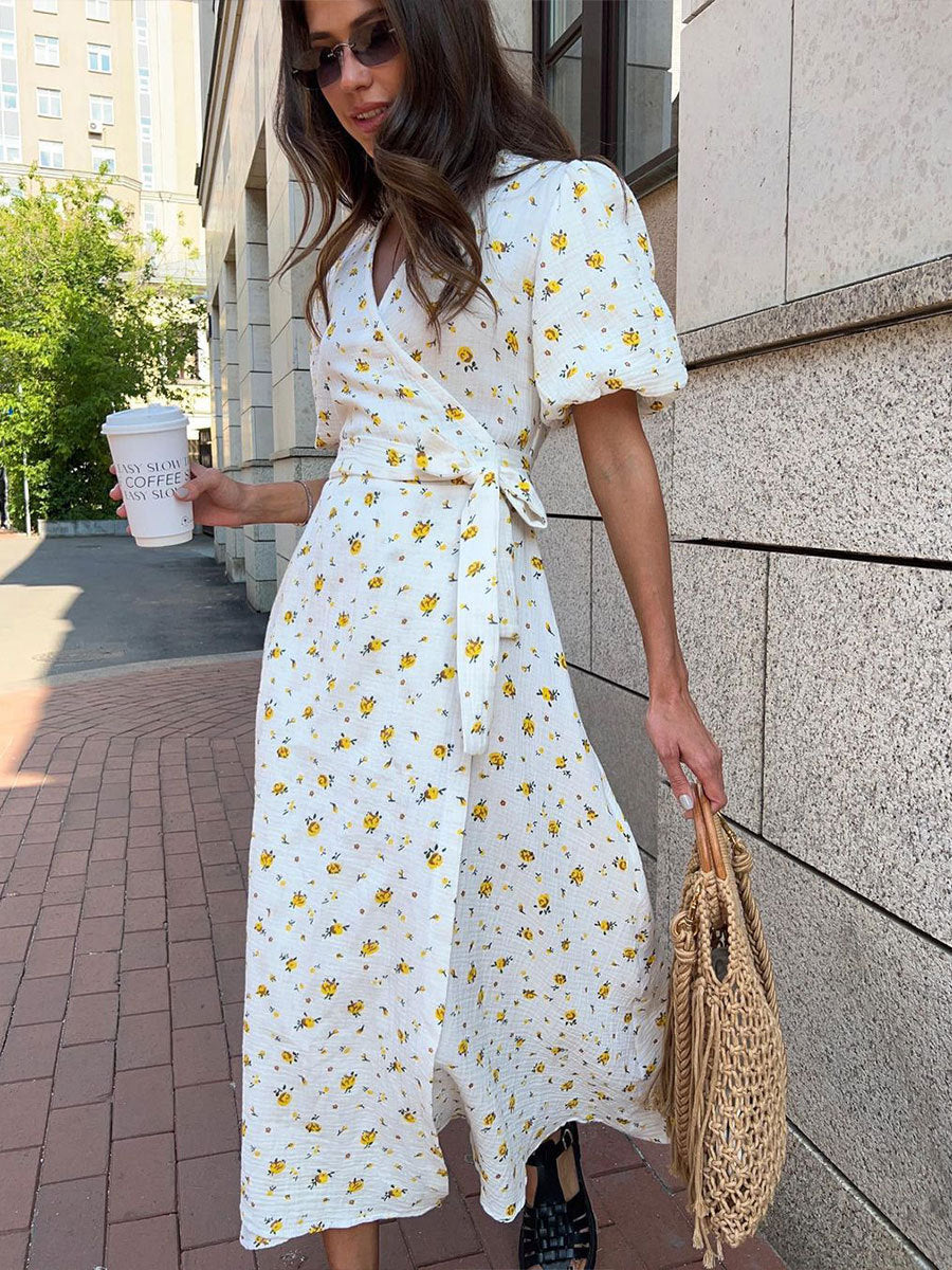 Cotton Floral Puff-Sleeve Wrap Midi Dress in Yellow Floral — side view on model