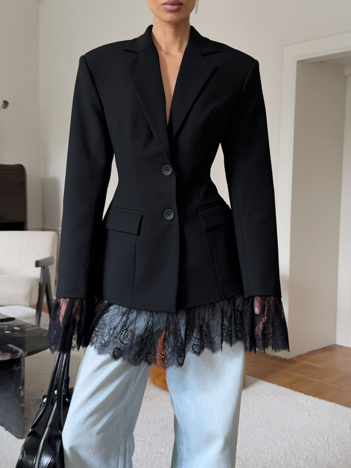 Fitted Blazer with Lace-Trimmed Hem and Cuffs in Black — front view on model