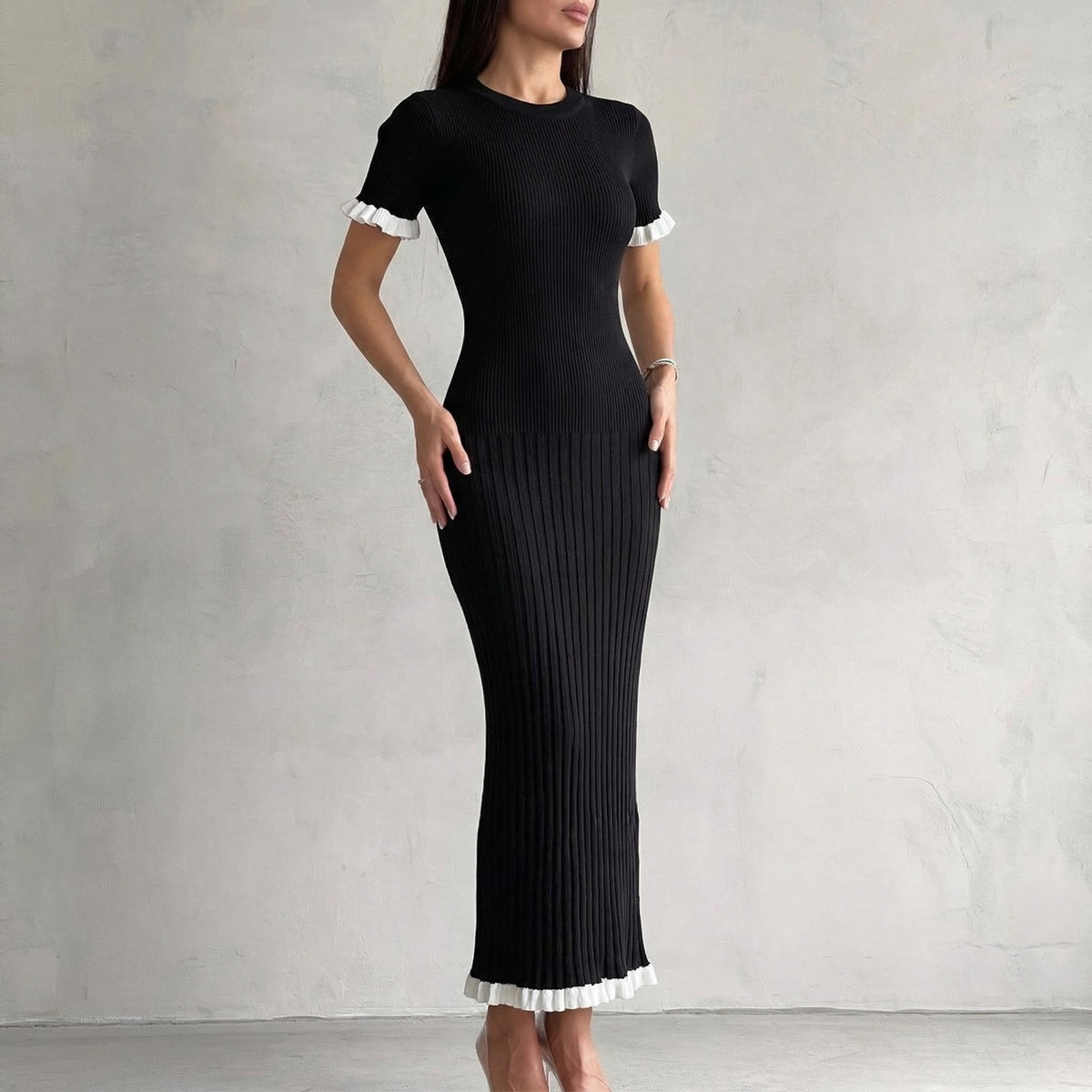 Contrast Ruffle-Trim Short Sleeve Knit Maxi Dress in Black — front view on model