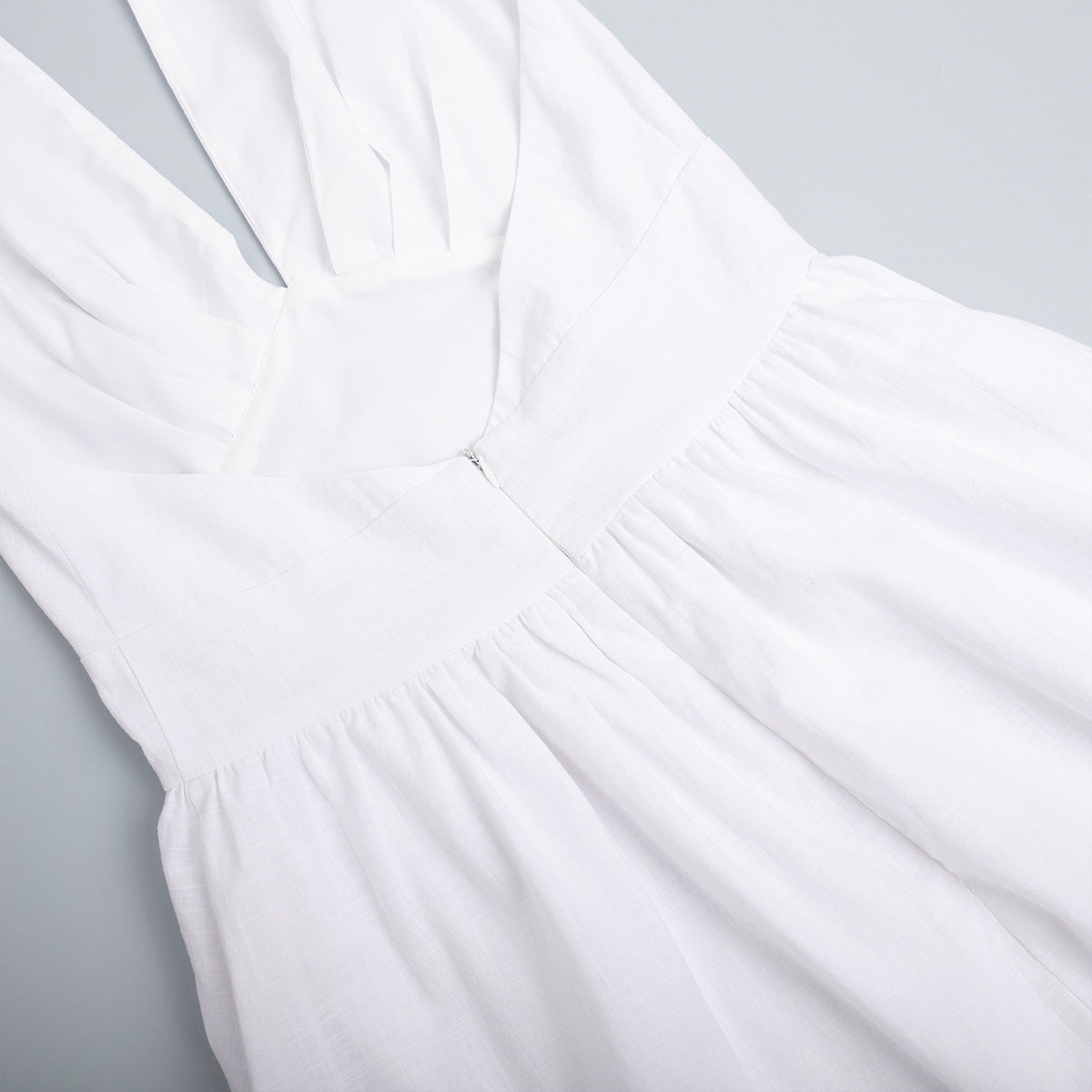Cotton Halter V-Neck Maxi Dress in White — close-up of the V-neck
